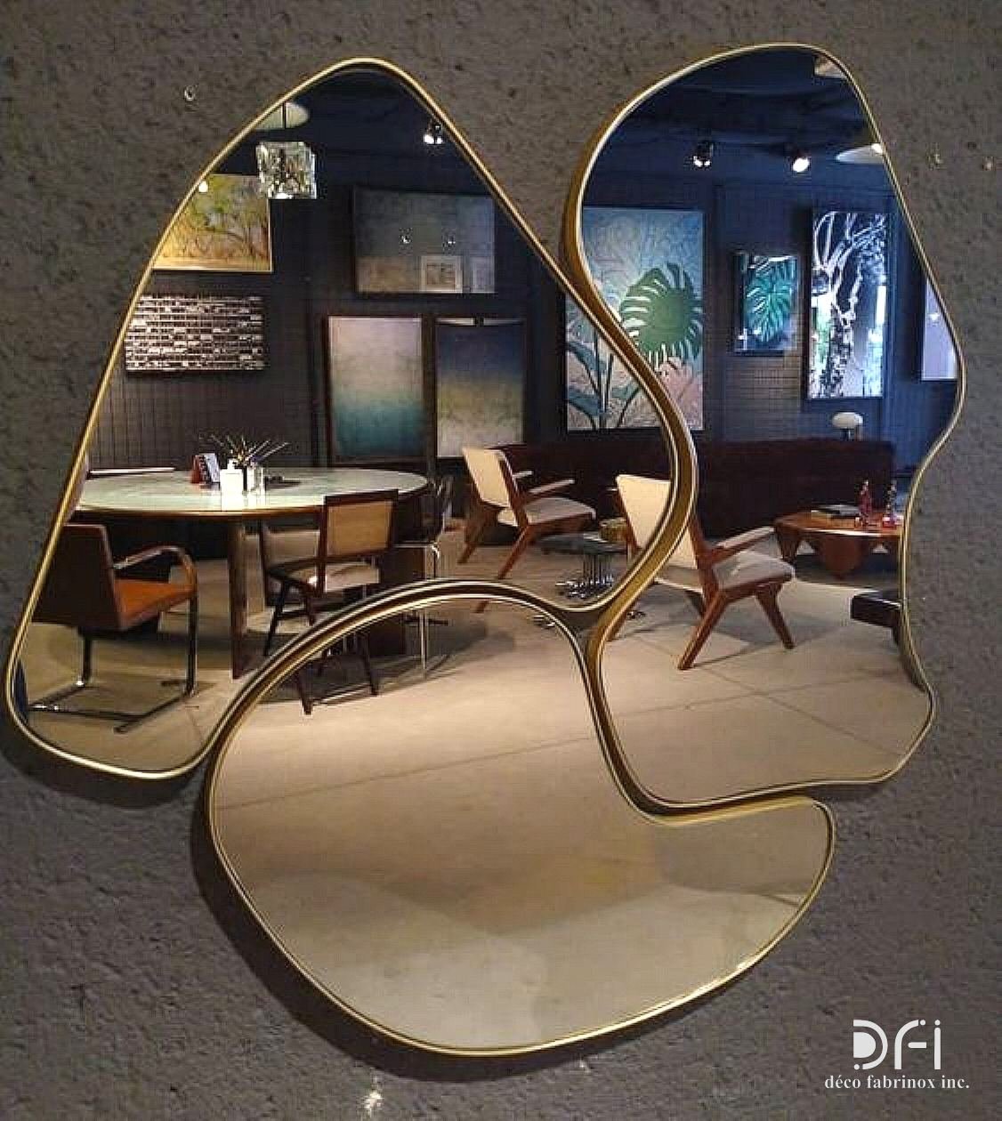 Pair of organic-shaped mirrors in slim brass frames