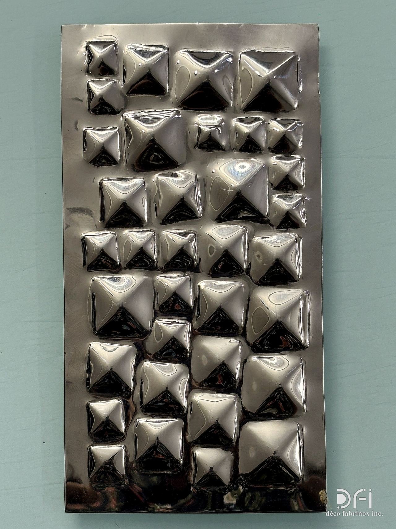 Polished steel pyramid-stud 3D wall panel