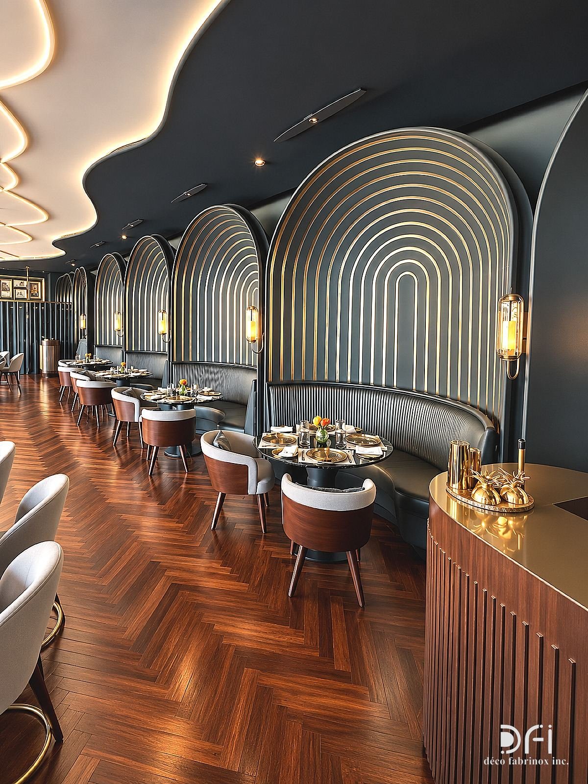 Arched restaurant booths outlined in brass trims