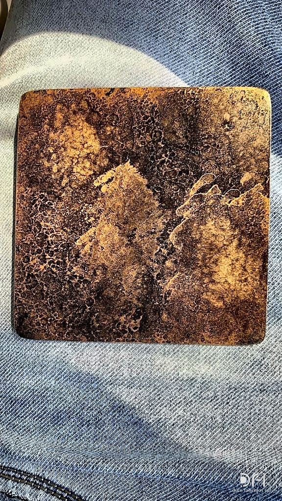 Gold and black marbled patina sample