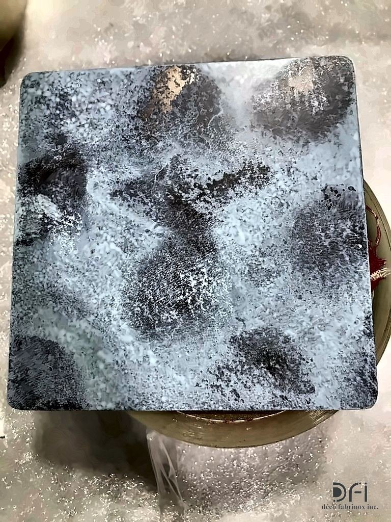 Hammered metal sample with a silver-blue patina
