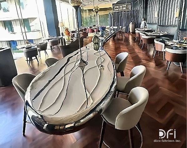 Polished stainless steel and marble bar counter in a fine-dining restaurant