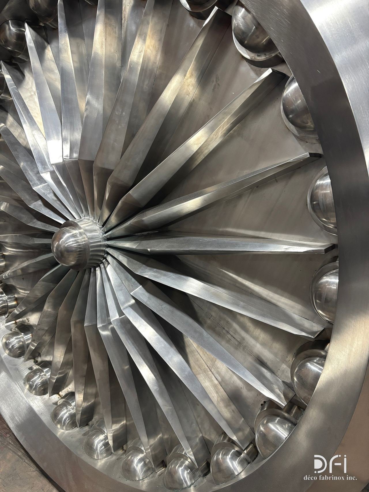 Folded steel blades of a turbine medallion, close view
