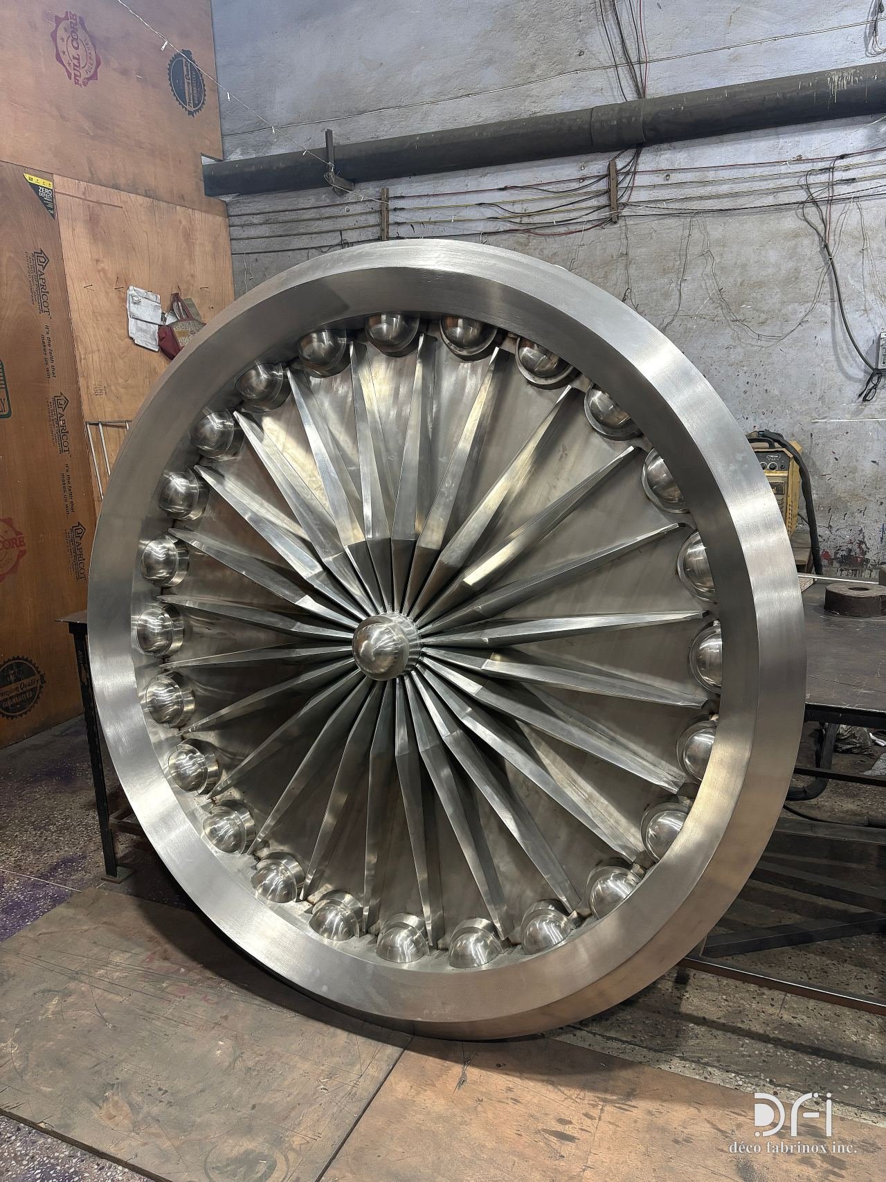 Large stainless-steel turbine medallion in the workshop