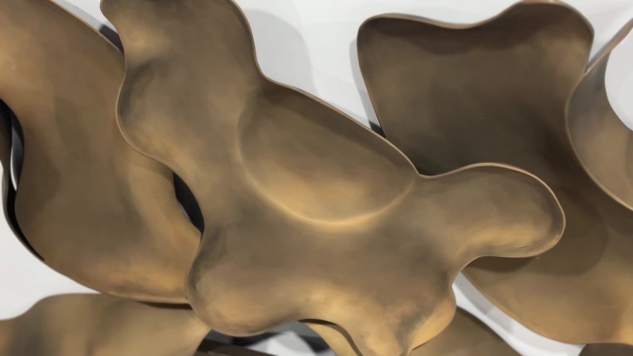 Bronze ribbon wall sculpture