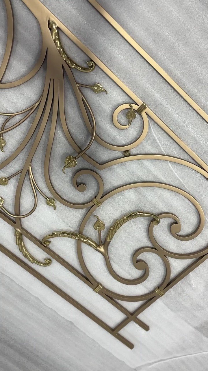 Scroll railing with gilded leaves