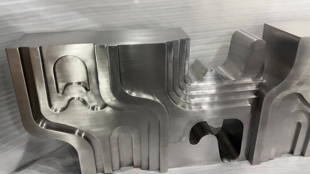 Sculpted steel console